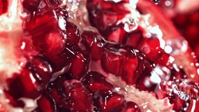 Splashed water pours onto fresh pomegranates. Filmed on a high-speed camera at 1000 fps. High quality FullHD footage - Powered by Shutterstock - Get 15% off with code: PIKWIZARD15