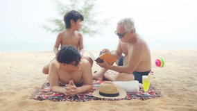 4K Happy Asian family enjoy and fun outdoor lifestyle travel ocean on summer beach holiday vacation. Three Generation men family relaxing and playing together at tropical island beach in sunny day. - Powered by Shutterstock - Get 15% off with code: PIKWIZARD15