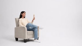 Caucasian woman waves and asks during a video call isolated on white background