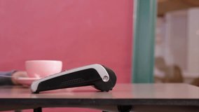 Happy woman paying with NFC technology as her mobile phone at payment terminal - Powered by Shutterstock - Get 15% off with code: PIKWIZARD15