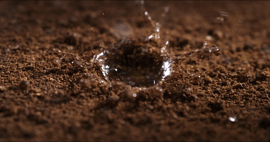 Super slow motion macro of splashing rain water drops are falling on young fresh rural farmland agricultural plantation fertilized field ground at 1000 fps. Royalty-Free Stock Footage #3432265491