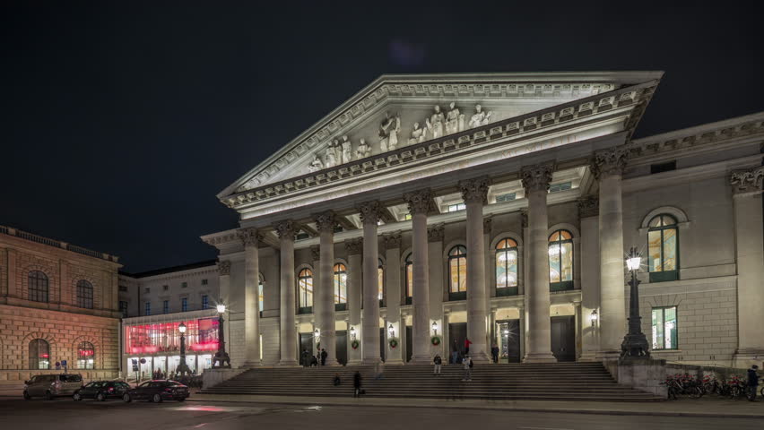 Munich National Theatre or Nationaltheater on the Max Joseph square night timelapse hyperlapse. Illuminated historic opera house front view, home of the Bavarian State Opera. Germany Royalty-Free Stock Footage #3432278275