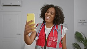 African american woman nurse video calling in clinic