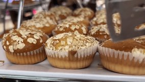 Healthy cupcakes. Banana bread muffins with nuts and oatmeal. Macro video. Cupcake inside, visible texture, broken baking on the wire rack .oatmeal muffin