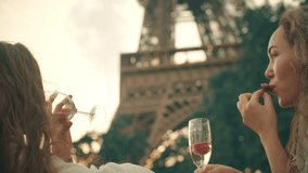Young woman having picnic at the Eiffel Tower in Paris, France - Powered by Shutterstock - Get 15% off with code: PIKWIZARD15