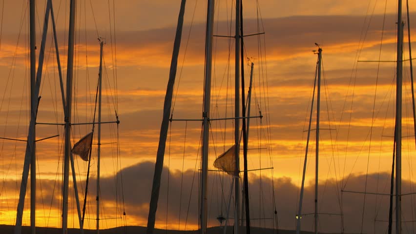 Beautiful sunset on pier with many yachts creates calming atmosphere. Tranquil background for meditation. Royalty-Free Stock Footage #3432355521
