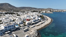 Aerial drone video of whitewashed traditional settlement of Paroikia or Parikia with unique Cycladic architecture main village or hora of Paros island, Cyclades, Greece