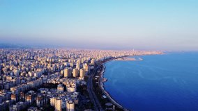 Explore Mersin, Turkey from above: breathtaking aerial panorama for travel fans. Discover travel gems, vibrant city life, sea horizon under clear blue sky. Perfect for travel planning