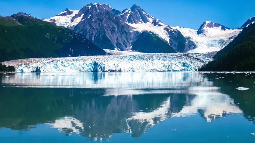 Cruise in Columbia Glacier mirrored to the Sea, Prince William Sound, Alaska in United States of America. Cinemagraph background.