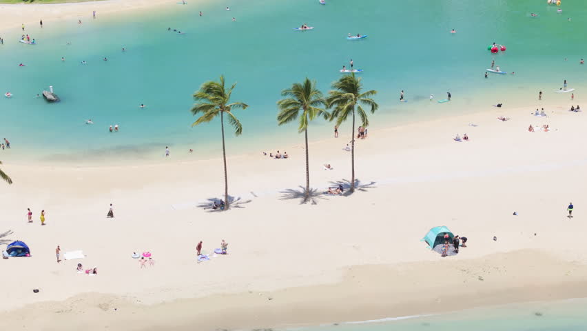 Tourists tanning swimming relaxing at white beach and blue lagoons on Oahu. Families enjoy summer.Waikiki resort travel destination background. Happy people traveling by scenic tropical Hawaii islands Royalty-Free Stock Footage #3432505943