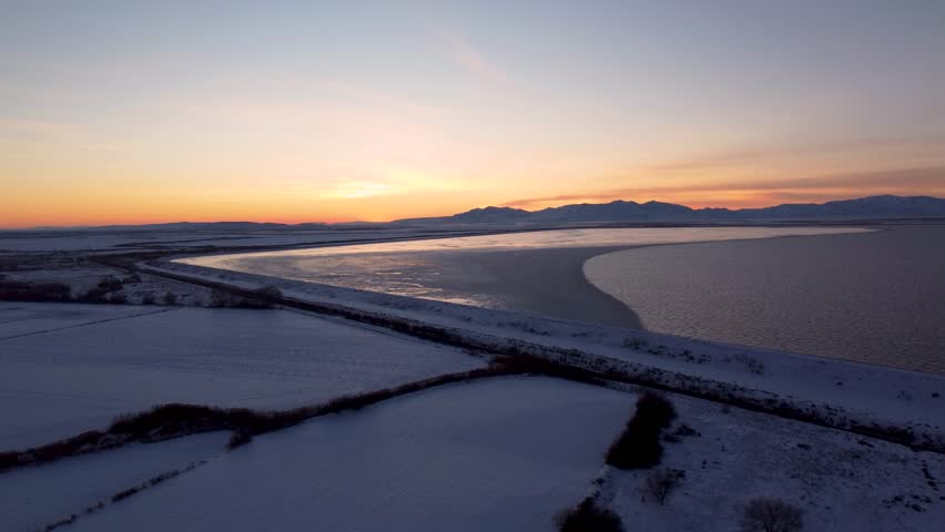 4k Aerial Drone Snow-Capped Mountains Overlooking Willard Bay, Utah