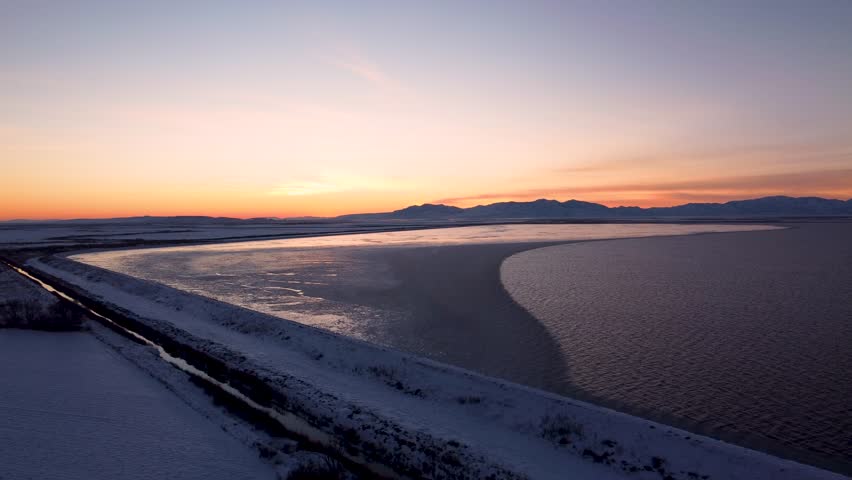 4k Aerial Drone Snow-Capped Mountains Overlooking Willard Bay, Utah