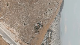 Vertical video. Athens, Greece. St Marina of Neon Ikonion. Greek Orthodox Church. Perama, Aerial View - Powered by Shutterstock - Get 15% off with code: PIKWIZARD15