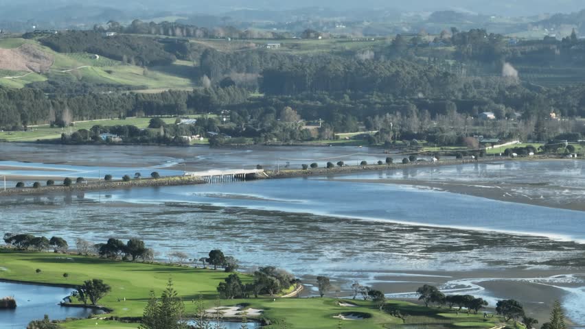 Aerial: Beach and sandspit in the holiday town of Omaha, near Warkworth, New Zealand