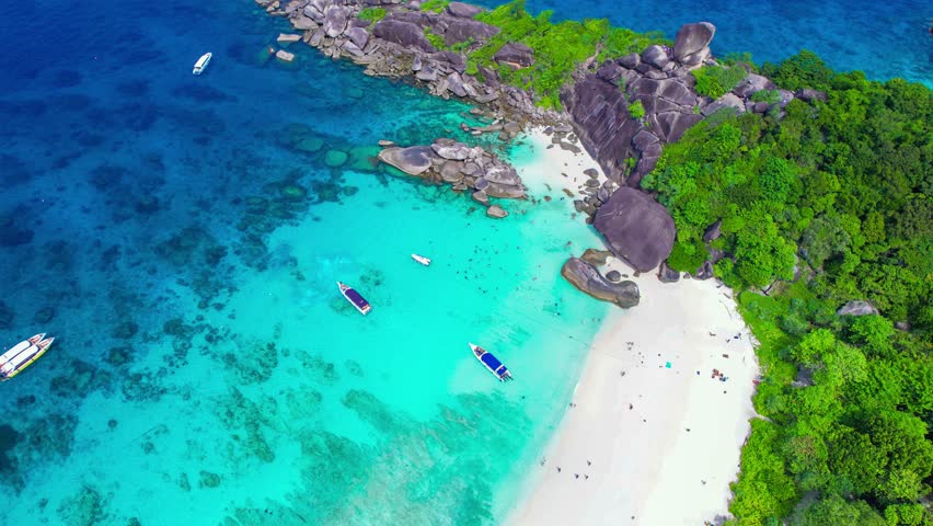 Aerial view of the Similan Islands, Andaman Sea, natural blue waters, tropical sea of Thailand. the beautiful scenery of the island is impressive. Royalty-Free Stock Footage #3432657573