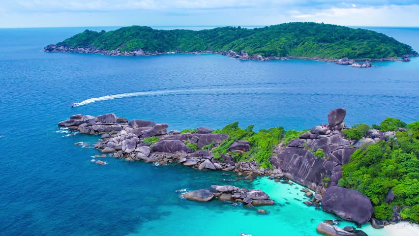 Aerial view of the Similan Islands, Andaman Sea, natural blue waters, tropical sea of Thailand. the beautiful scenery of the island is impressive. Royalty-Free Stock Footage #3432662583