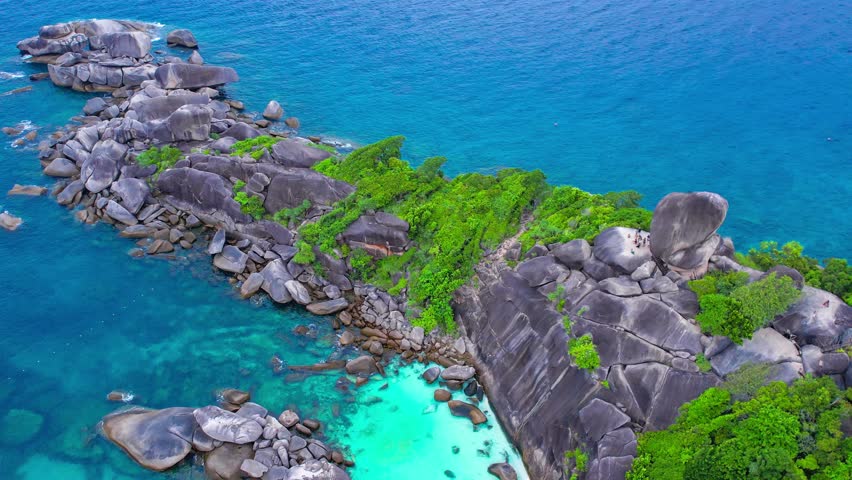 Aerial view of the Similan Islands, Andaman Sea, natural blue waters, tropical sea of Thailand. the beautiful scenery of the island is impressive. Royalty-Free Stock Footage #3432665947