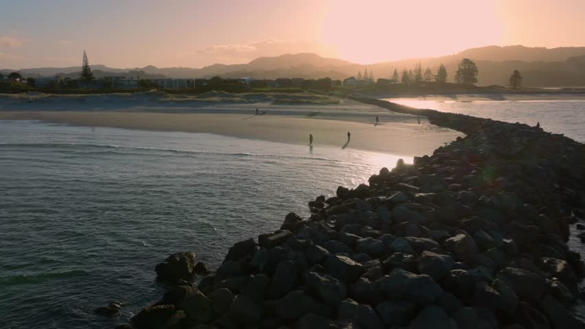 Aerial: Beach and sandspit in the holiday town of Omaha, near Warkworth, New Zealand