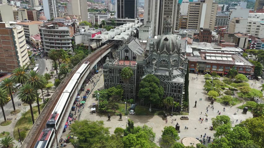 Establishing Aerial of Downtown Medellin City Buildings and Trains
