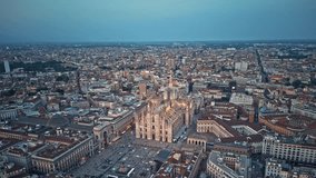 Aerial Hyper lapse Time Lapse of Milan Cathedral Illuminated Piazza Del Duomo Di Milano And `Milano Skyline At Dusk, 4K Footage in Milan Italy