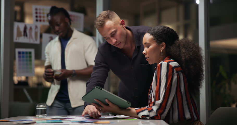 Business people, tablet and planning for design at night, creative agency and vision for fashion project. Businessman, manager and problem solving in meeting for deadline, colors and sketch ideas