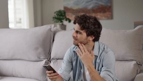 Closeup focused young man reading email on phone at home office. Portrait of male freelancer getting idea at remote workplace. Handsome guy texting on smartphone on couch
 - Powered by Shutterstock - Get 15% off with code: PIKWIZARD15