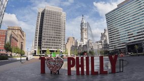 I love Philly Sign in downtown Philadelphia, Pennsylvania with view of the Philadelphia City Hall on a sunny summer day - Powered by Shutterstock - Get 15% off with code: PIKWIZARD15