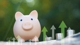 Concept of savings and investments . Piggy bank closeup with growth arrows and icons . Saving money for future and retirement fund, business or finance and investment. Pension, Vacations, Currency, fi