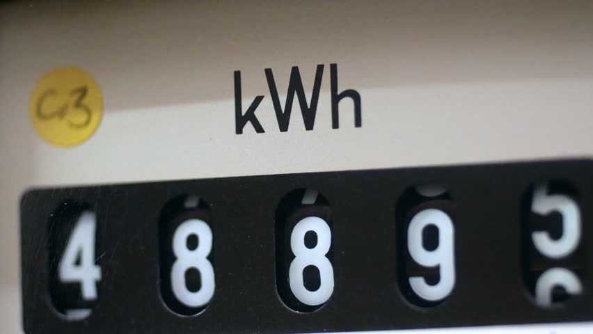 A close-up of an electricity meter kWh symbol with shallow focus and energy consumption numbers. Concept for electric meter reading, fuel, heating, high bills and cost of living. Static shot. Royalty-Free Stock Footage #3433060441