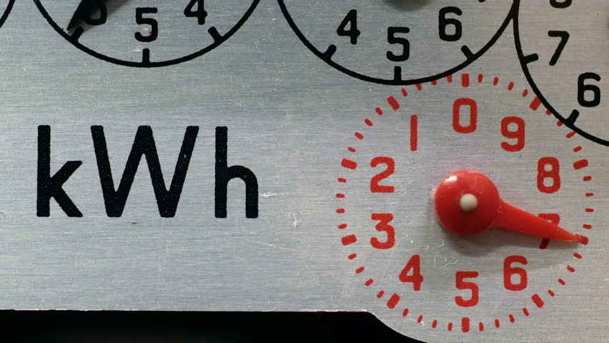 A close-up of an electricity meter kWh symbol and red numbered dial. concept for electric meter reading, energy, fuel, heating, high bills and cost of living. Static shot. Royalty-Free Stock Footage #3433060535