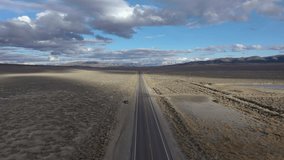 Car driving on highway 50 across Nevada, loneliest road in America. Aerial drone follow shot. - Powered by Shutterstock - Get 15% off with code: PIKWIZARD15