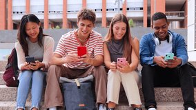 Group of multiracial highschool students having fun watching a social media app on a smartphone at university campus. Young classmates using a cellphone. Happy friends browsing internet with a phone - Powered by Shutterstock - Get 15% off with code: PIKWIZARD15