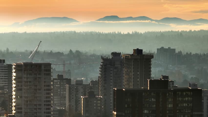 West End Vancouver Skyline And Mystic Landscape In Fog At Sunset In British Columbia, Canada. aerial ascending shot