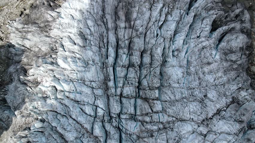 A top-down aerial shot of a large glacier in Switzerland Royalty-Free Stock Footage #3433193907