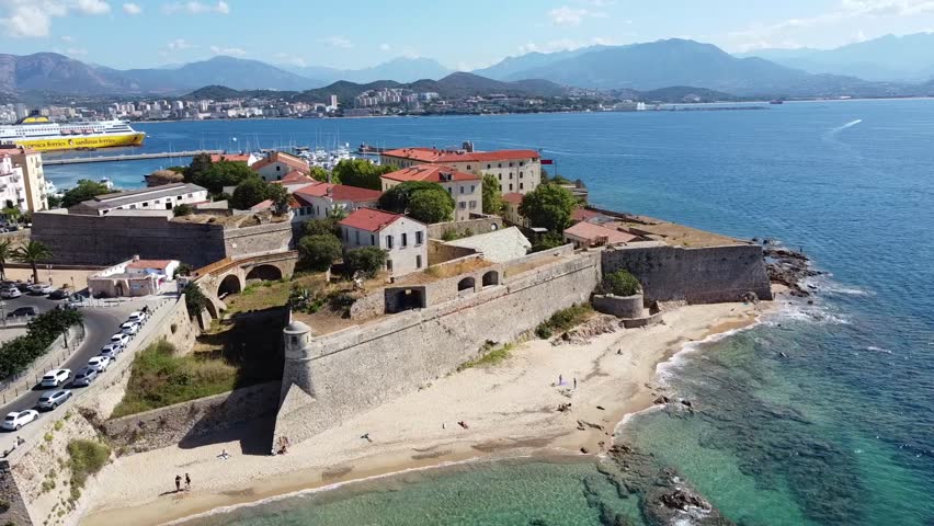 Aerial view of the Citadel of Ajaccio in Corsica - French maritime stronghold in the Mediterranean Sea with defensive walls on the beach Royalty-Free Stock Footage #3433228255
