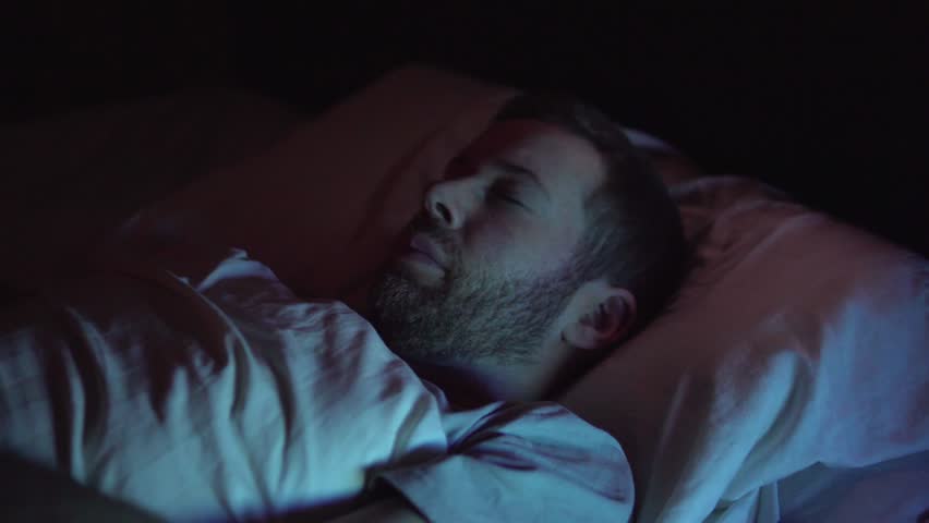 A Man Wakes From Nightmare, Bad Dream and Restless Sleep At Night
 Royalty-Free Stock Footage #34332916