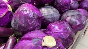 red cabbage vegetables counter in a supermarket or market in Vietnam Fresh red cabbage under water. With air bubbles. Texture. High quality 4k footage