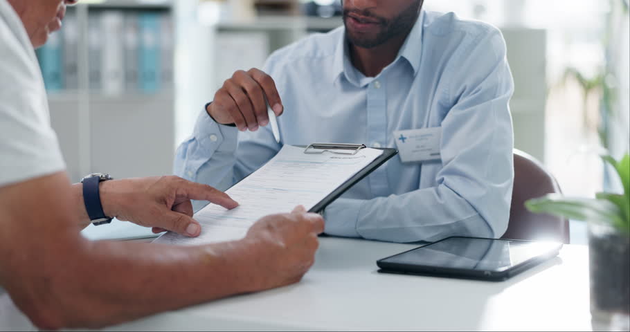 Man, doctor and hands with form in consultation for signature, application or health insurance at hospital. Closeup of person or medical employee explaining document or paperwork to patient at clinic Royalty-Free Stock Footage #3433375351