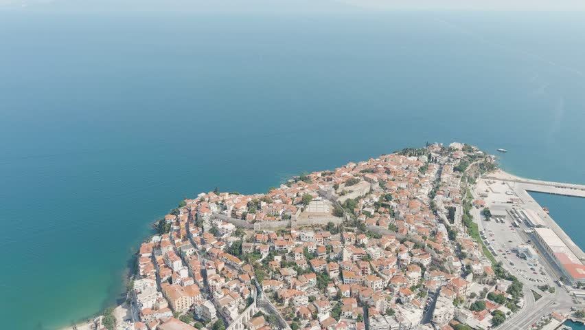 Kavala, Greece. Kavala Fortress and Aqueduct. Historic city center. Summer, Aerial View, Departure of the camera