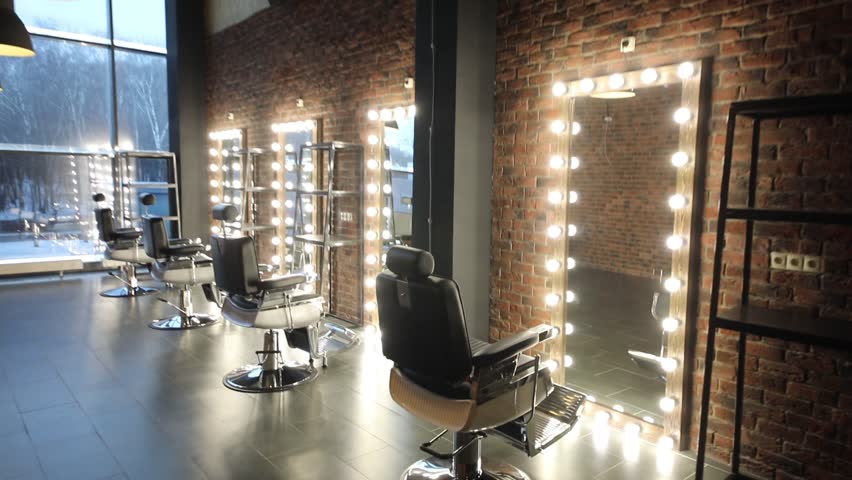 Movement along the chairs and mirrors to the window in the barbershop Royalty-Free Stock Footage #34334008