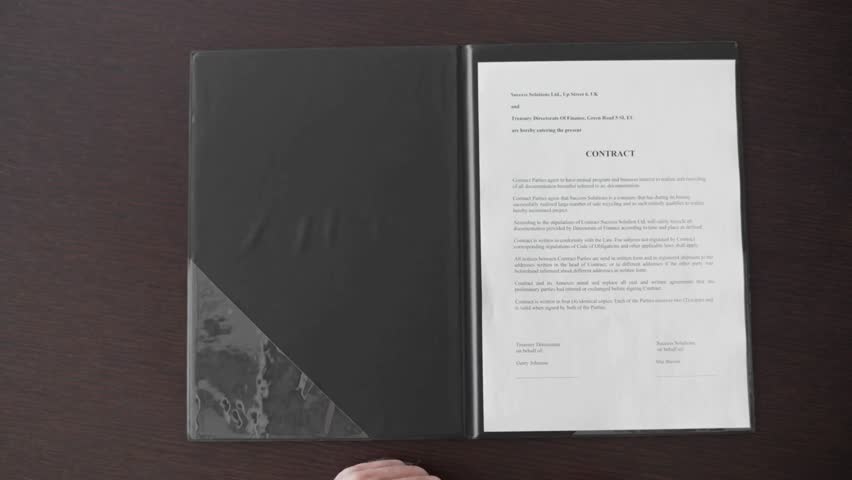 Businessman signing business contract agreement at office desk partnership or legal paperwork in office. Close-up of man