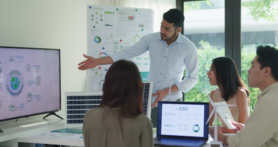 Group diverse Asia businesspeople talk ESG strategies risk management workshop, SDGs report, global warming, green finance and investment and net zero waste lifestyles in boardroom training building.