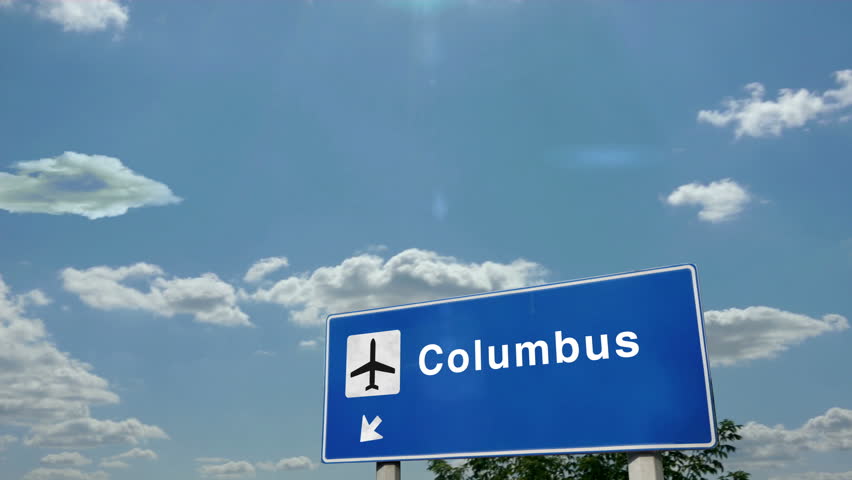 Columbus Ohio, USA Jet plane landing. City arrival with airport direction sign. Travel, business, tourism and airplane transport concept.