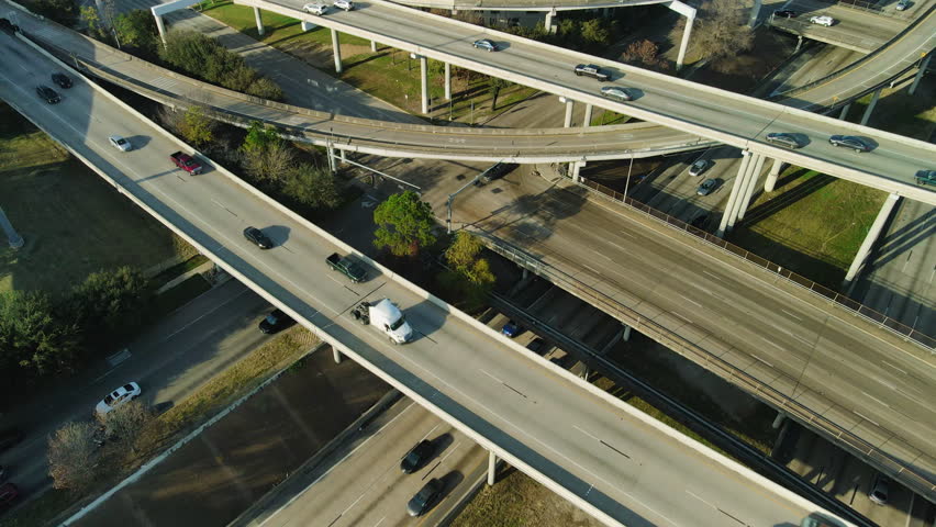 Establishing Houston Downtown Drone Shot 2024. Aerial Drone Fly Above Car Traffic of Houston Downtown at the huge intersection of I45 and I69, Cityscape Skyline