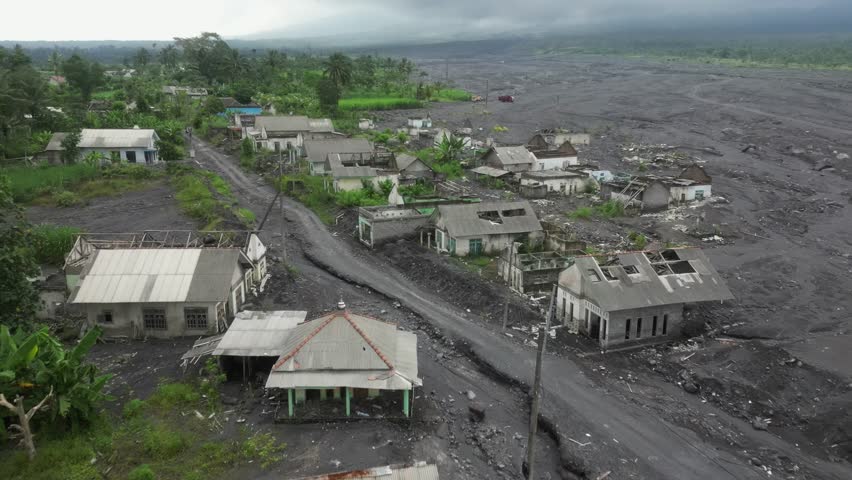 Village in shadow of Mt Semeru in Bali destroyed by 2021 eruption Royalty-Free Stock Footage #3433624519