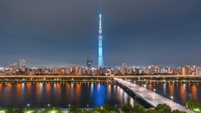 Aerial view time lapse 4k Video of Tokyo sky tree and Tokyo city at night at Tokyo, Japan. 