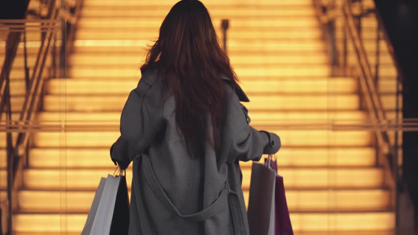 Successful, rich girl, running up the stairs to a fashion boutique for shopping, shopping centers, shopping, clothes, discounts, money, consumer, shopping, youth, joy, shopaholic Royalty-Free Stock Footage #3433669499
