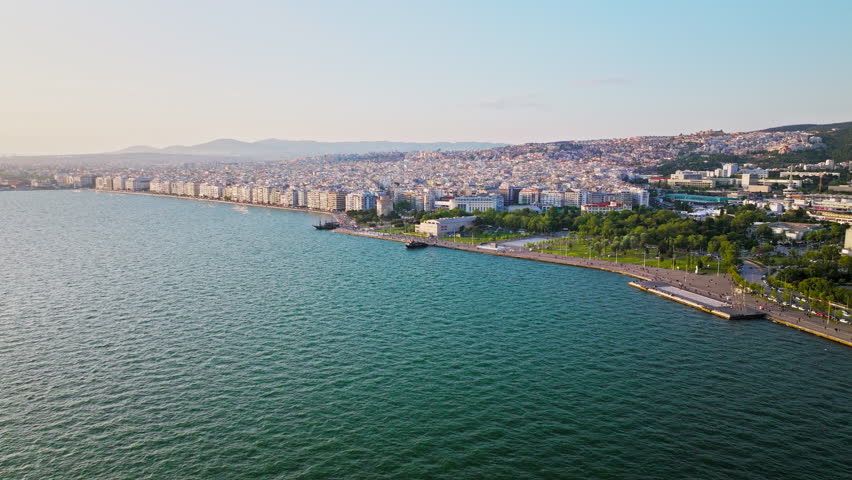 Aerial View of Landmark Ottoman Fortress White Tower of Thessaloniki. Waterfront of the city of Thessaloniki, Whitewashed Tower, Greek port city with tall buildings in Greece.