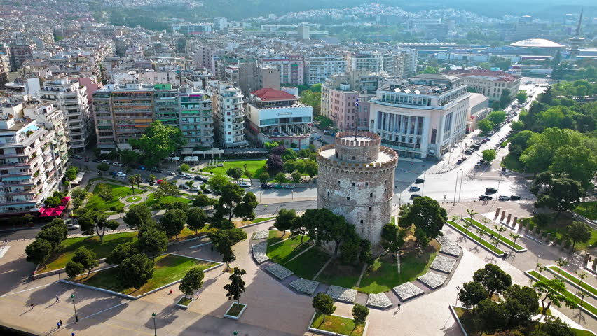 Aerial View of Landmark Ottoman Fortress White Tower of Thessaloniki. Waterfront of the city of Thessaloniki, Whitewashed Tower, Greek port city with tall buildings in Greece.