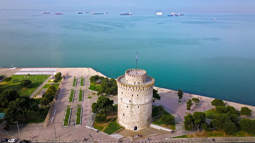 Aerial View of Landmark Ottoman Fortress White Tower of Thessaloniki. Waterfront of the city of Thessaloniki, Whitewashed Tower, Greek port city with tall buildings in Greece.